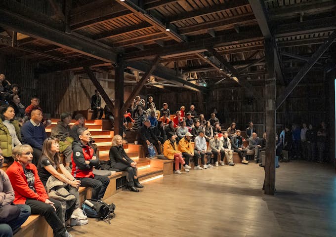 People gather to watch a lecture on Antarctica at Explorers House, Punta Arenas, Chile