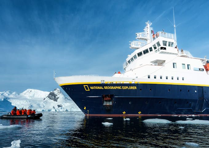 The National Geographic Explorer Antarctic ship and a zodiac sail in Antarctica 