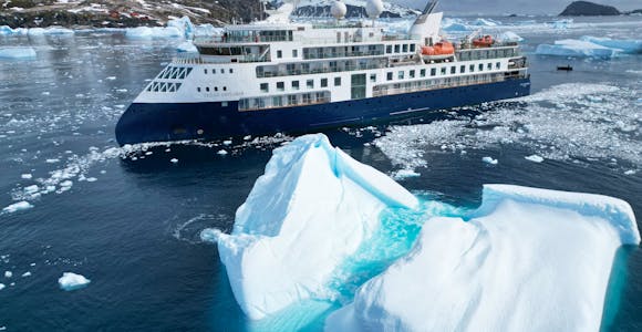 The Antarctic ship the Ocean Explorer and two large icebergs  