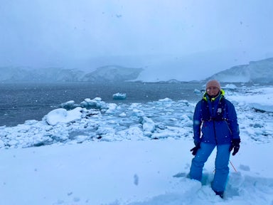 A woman poses in misty weather in Antarctica 