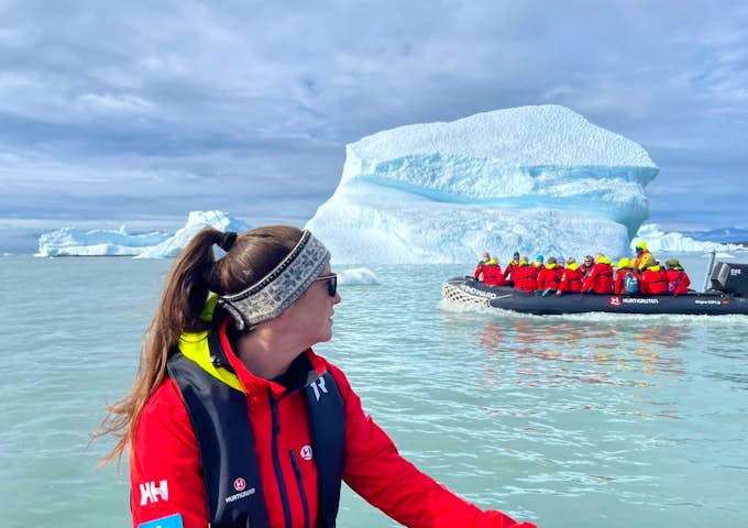 A woman explores Antarctica in a Zodiac boat 