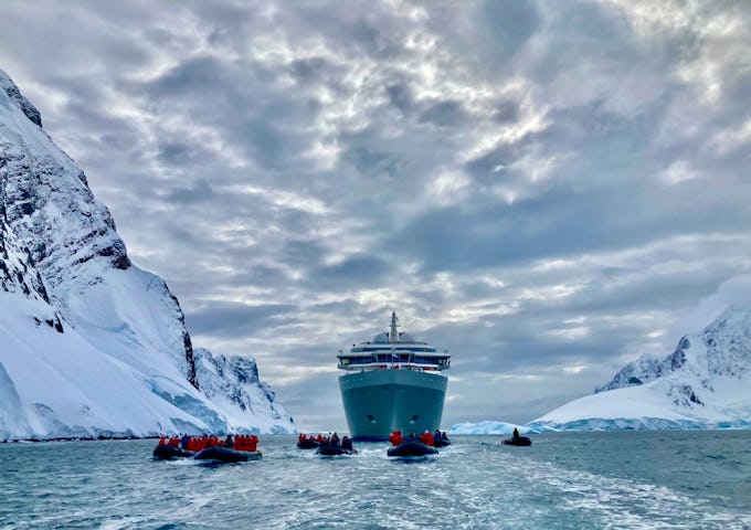 Silver Endeavour, Antarctic vessel and a fleet of zodiacs in the Lemaire Channel, Antarctica