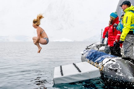 Female tourist doing the polar plunge in Antarctica