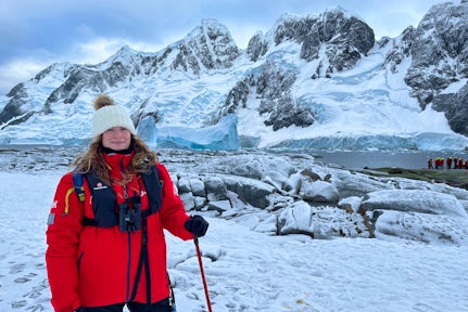 Female tourist in the snow on the Antarctic peninsula