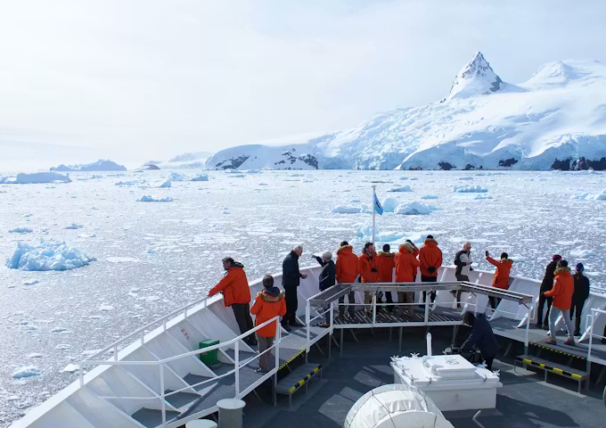 Bow view from the NG Explorer expedition cruise ship sailing through the Antarctic ice