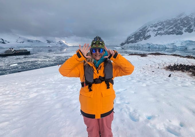 A woman celebrates as she sets foot on the 7th Continent 