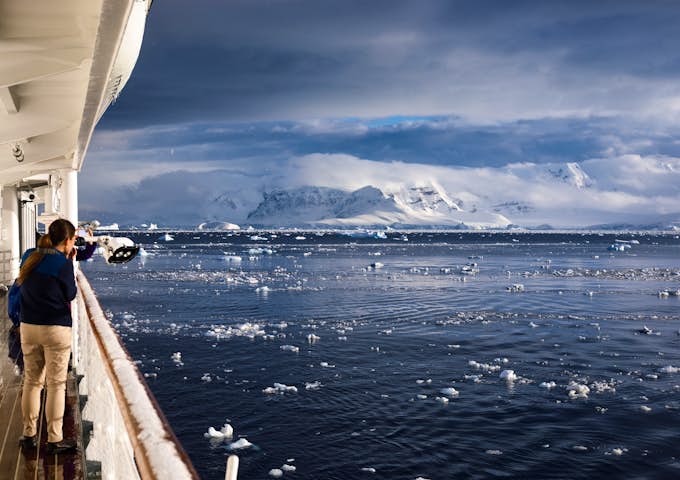 Looking out from a ship's deck across to the snowy landscape of the South Shetlands, Antarctica