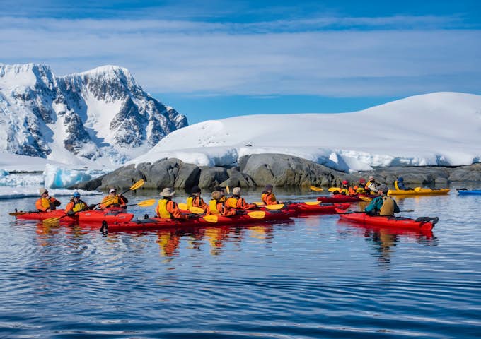Kayakers gather in a group Pleneau Island, Antarctica