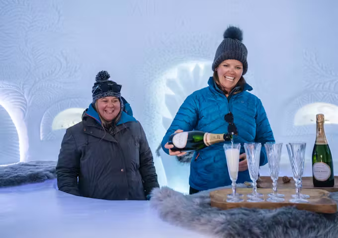 Drinking champagne at a luxury Antarctica camp